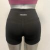 short_licra_pretina_alta_negro-posterior Short de licra con pretina alta y bolsas laterales